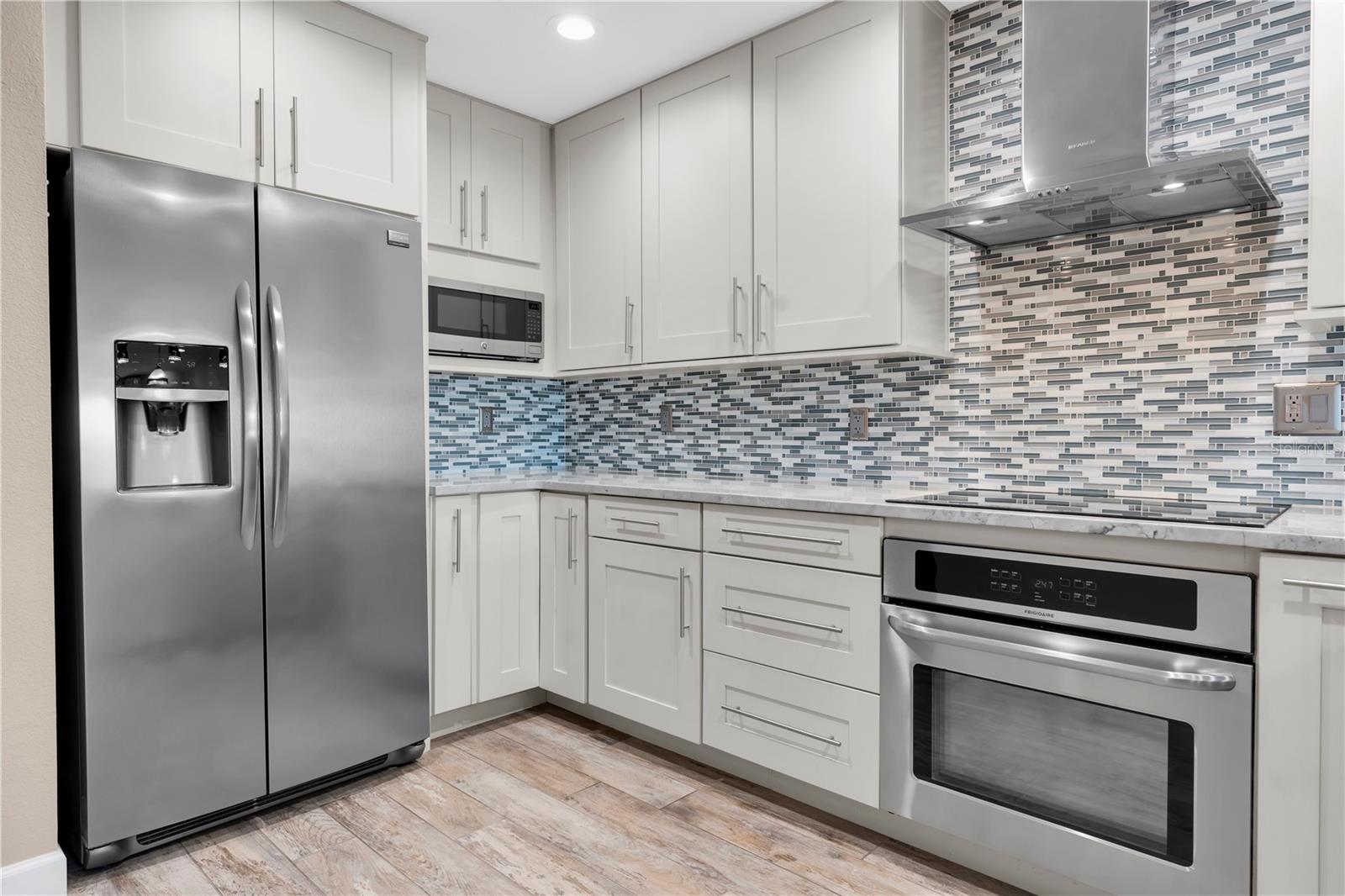 Sleek stainless appliances and clean cabinetry come together for a kitchen that's as functional as it is good-looking — built for real life, styled for entertaining.