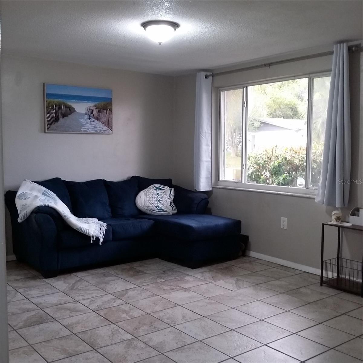 Living room moving towards hallway - linen closet, Bath & 2 BR's