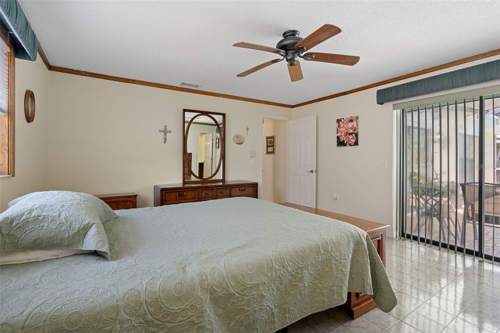 Primary Bedroom with Sliders to Lanai and Pool