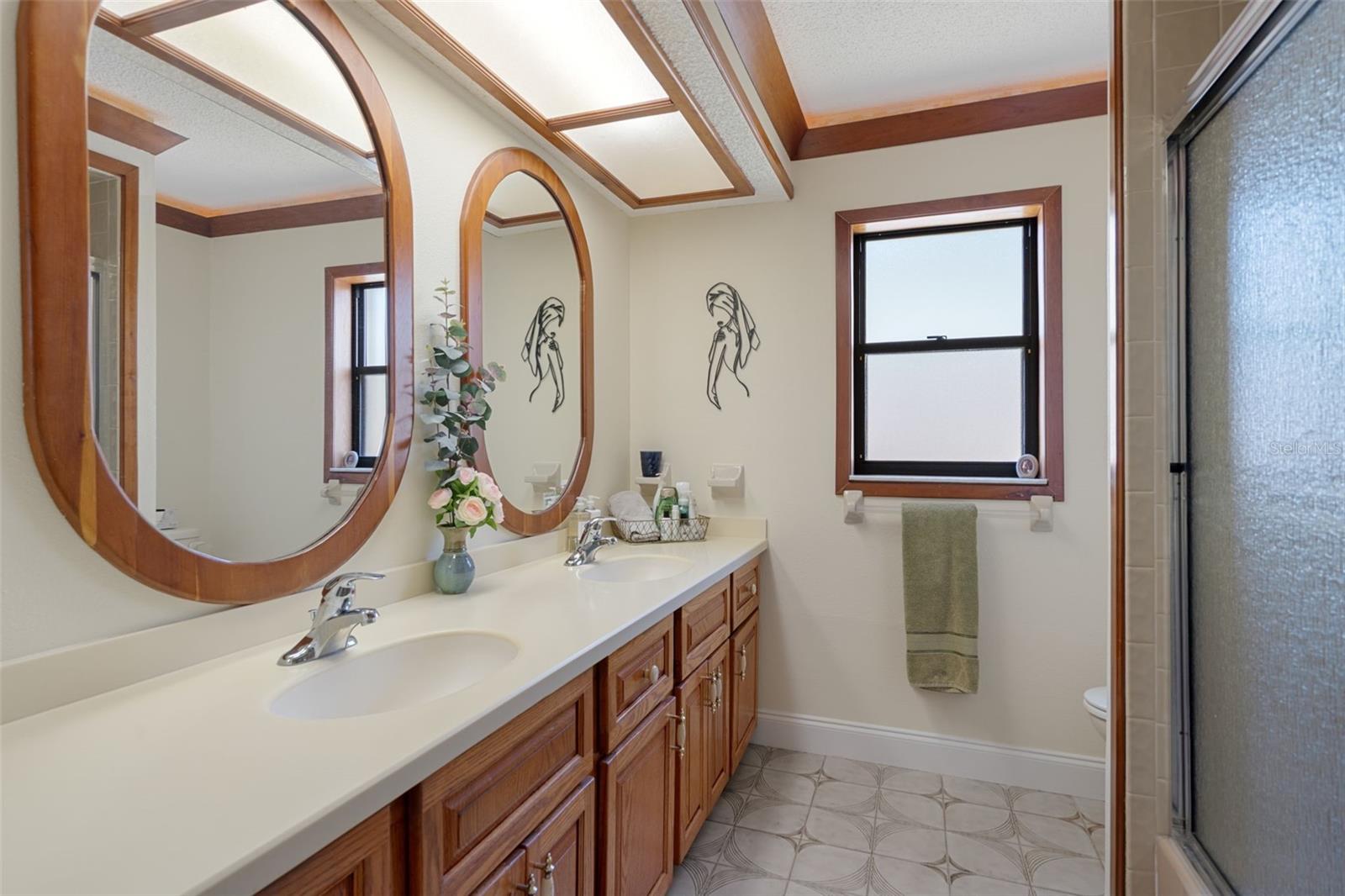 Guest Bath with Double Sinks with Corian Top and Tub