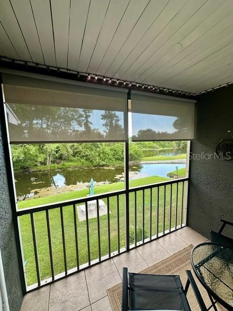 Balcony with bistro set overlooking preserve and pond
