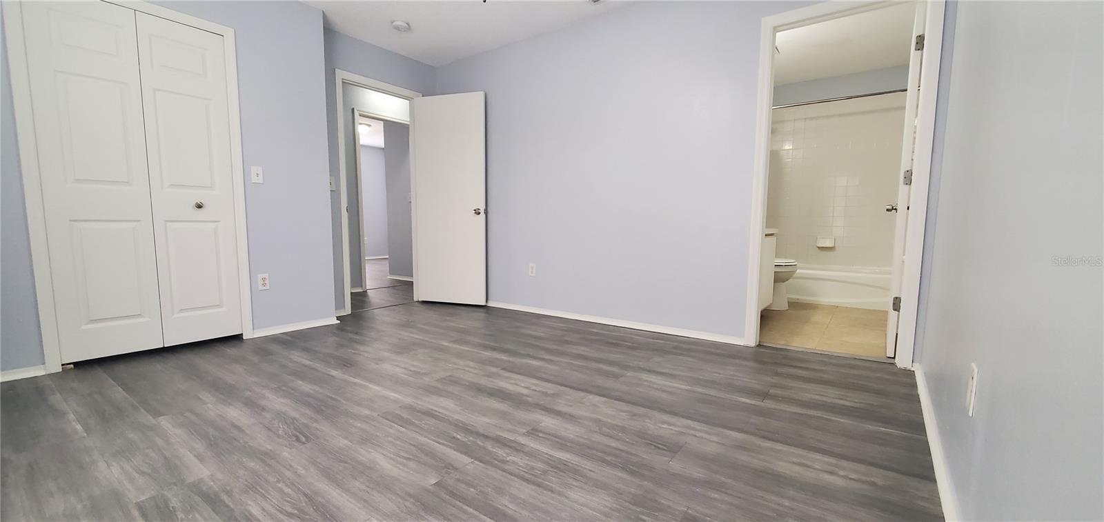 Primary suite looking towards bathroom.