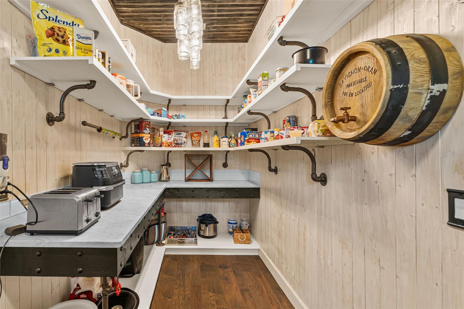 More than generous storage, the walk-through pantry creates a seamless connection between the dining room and chef's kitchen, making entertaining effortless.