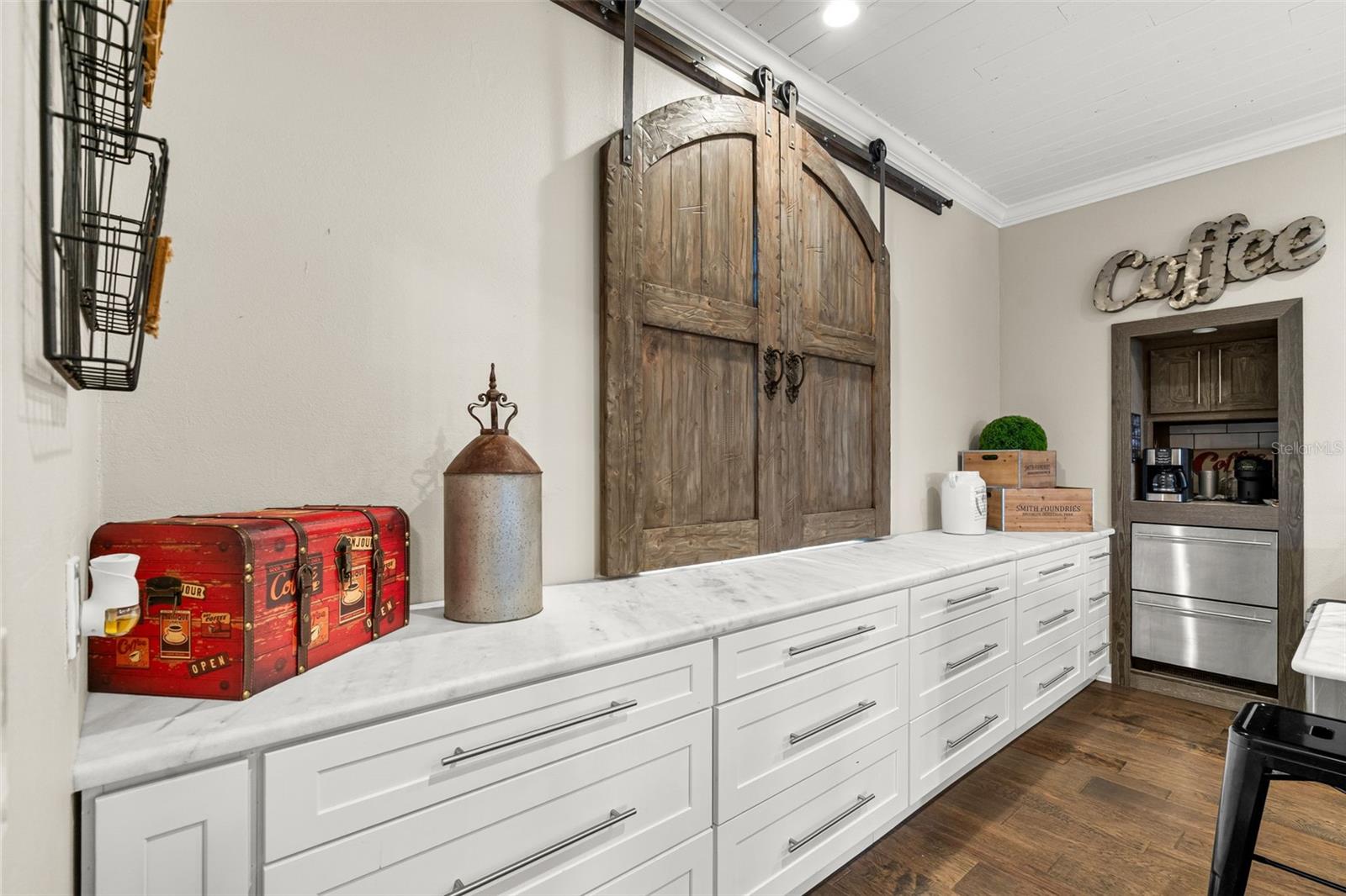 Thoughtfully selected design elements, including the custom barn-door window feature, reflect the home's unique craftsmanship.