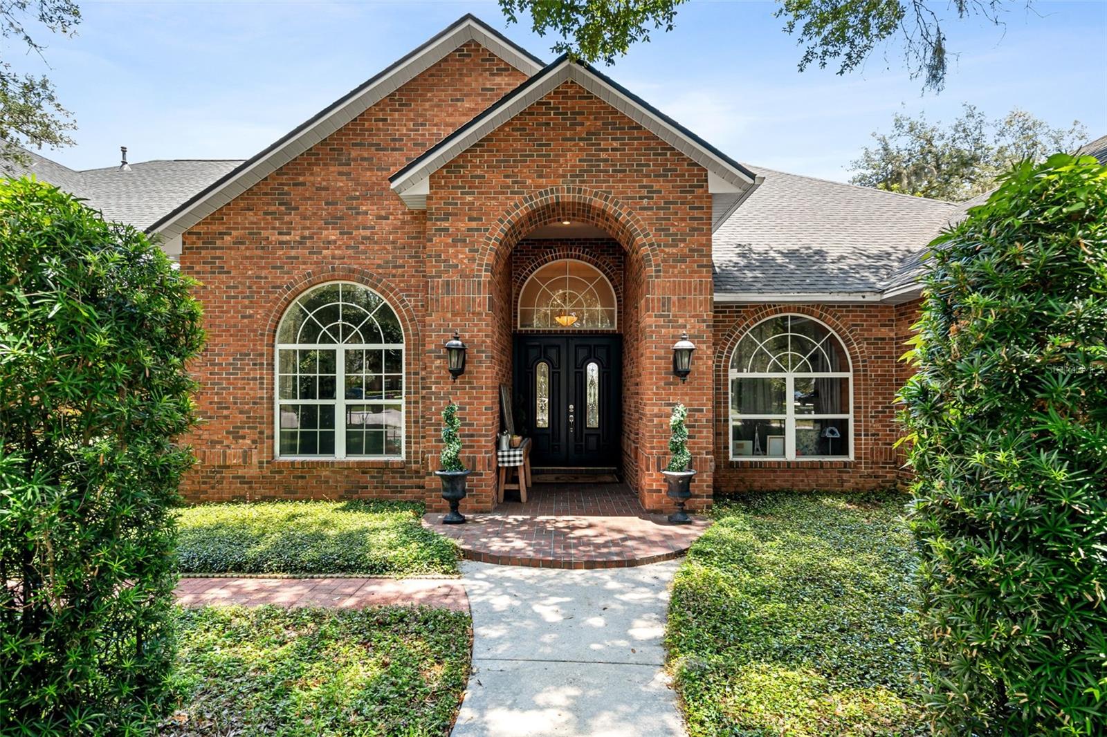 A welcoming front porch and handcrafted entry invite you inside to discover a home where timeless architecture meets exceptional design.