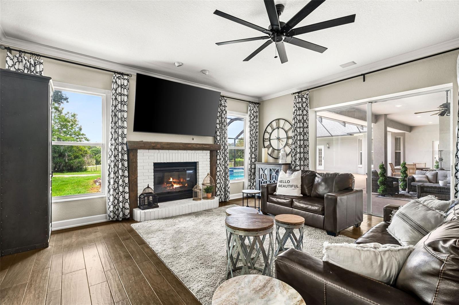 Warm, inviting, and filled with natural light, the family room is designed to bring everyone together while embracing views of the outdoor living space.
