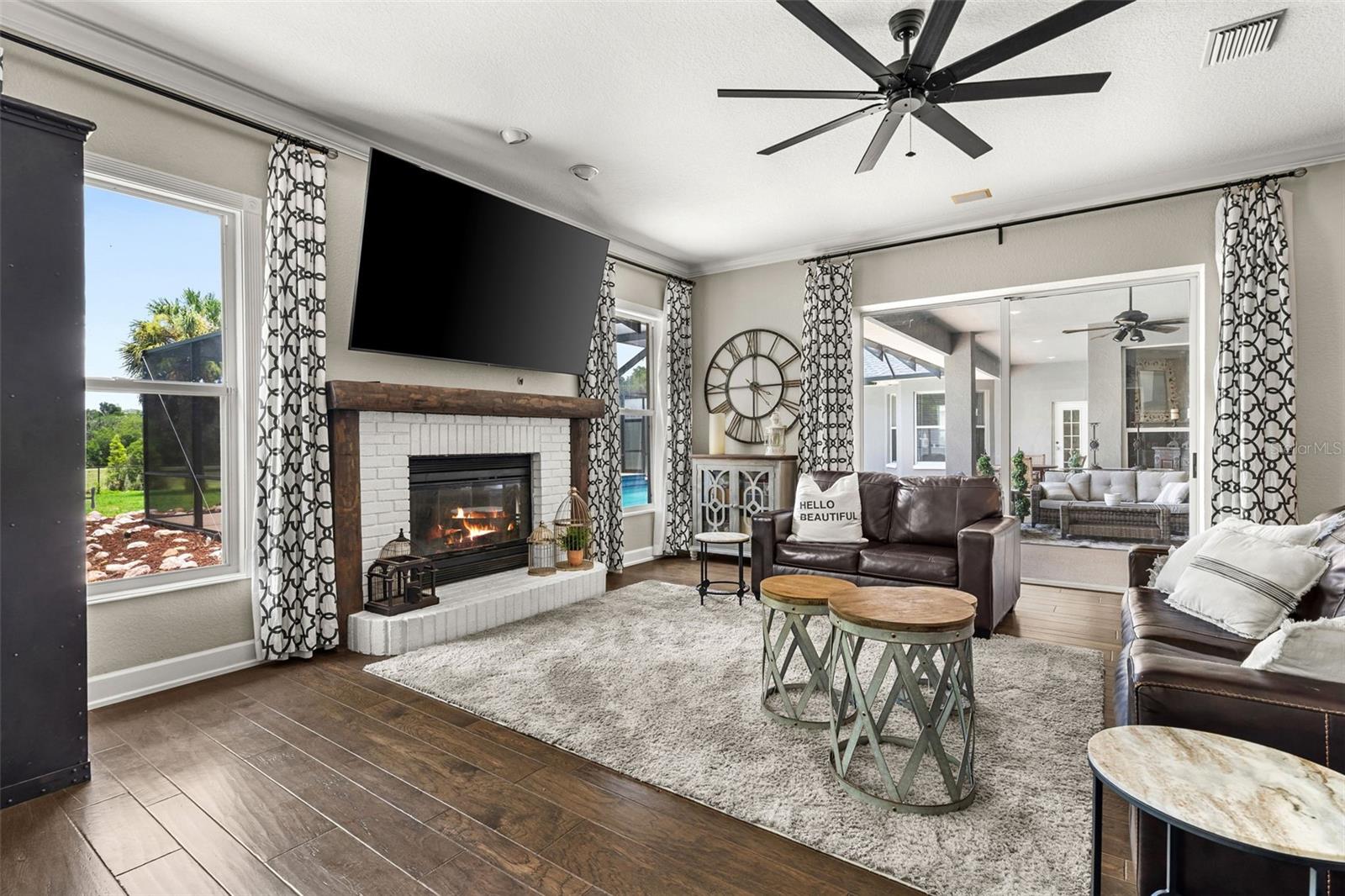 Anchored by a beautiful fireplace, this comfortable gathering space is equally suited for quiet evenings or entertaining family and friends.