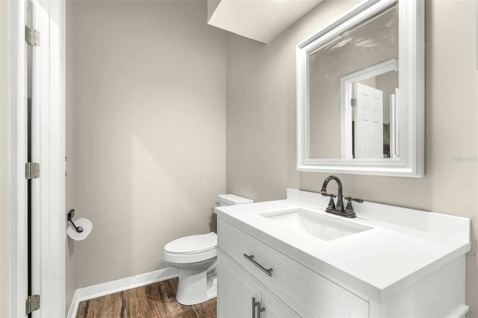 Offering both privacy and functionality, Bedrooms 2 and 3 each include a private vanity and water closet with access to a shared Jack-and-Jill shower.