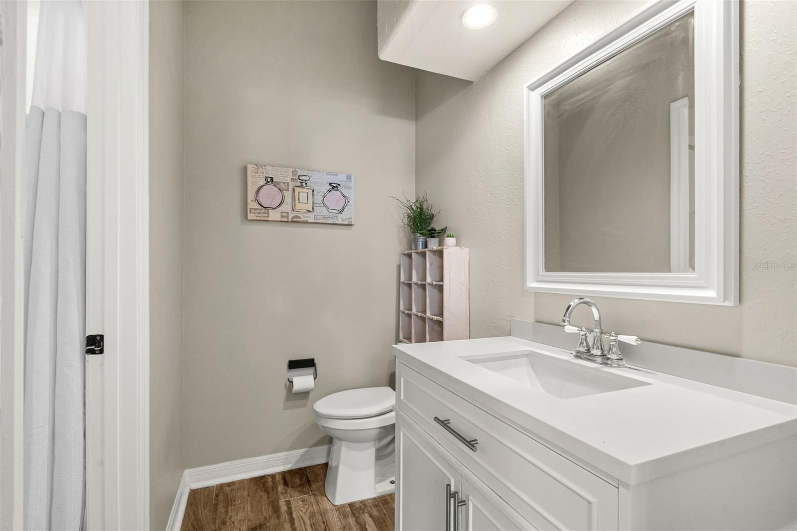 Offering both privacy and functionality, Bedrooms 2 and 3 each include a private vanity and water closet with access to a shared Jack-and-Jill shower.