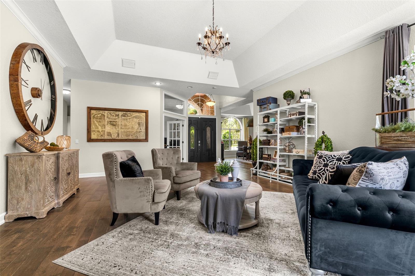 Straight ahead, expansive windows frame the sparkling pool, creating a seamless connection between indoor comfort and outdoor living.