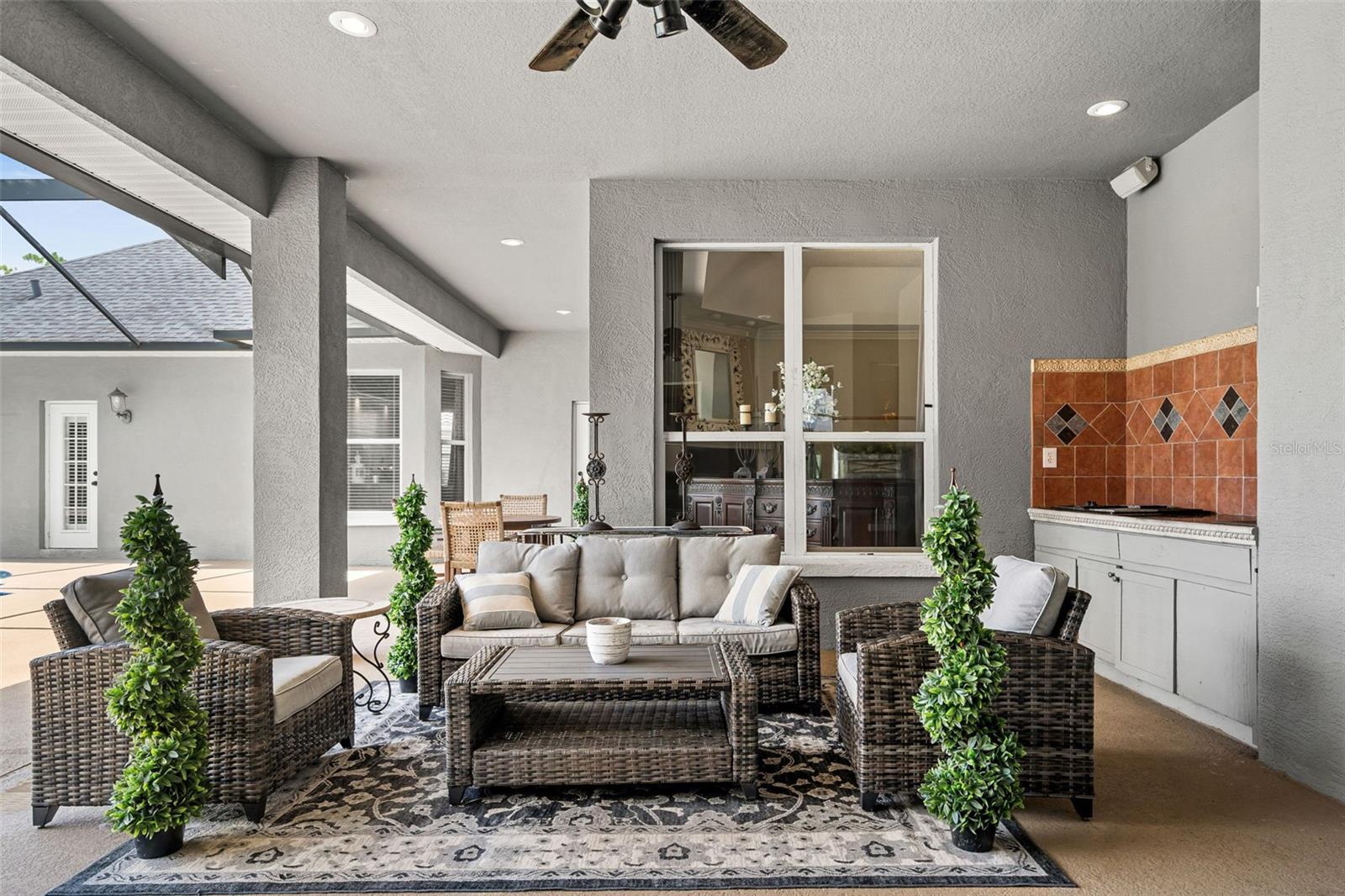 Step outside to a covered lanai where indoor comfort transitions effortlessly into exceptional outdoor living.