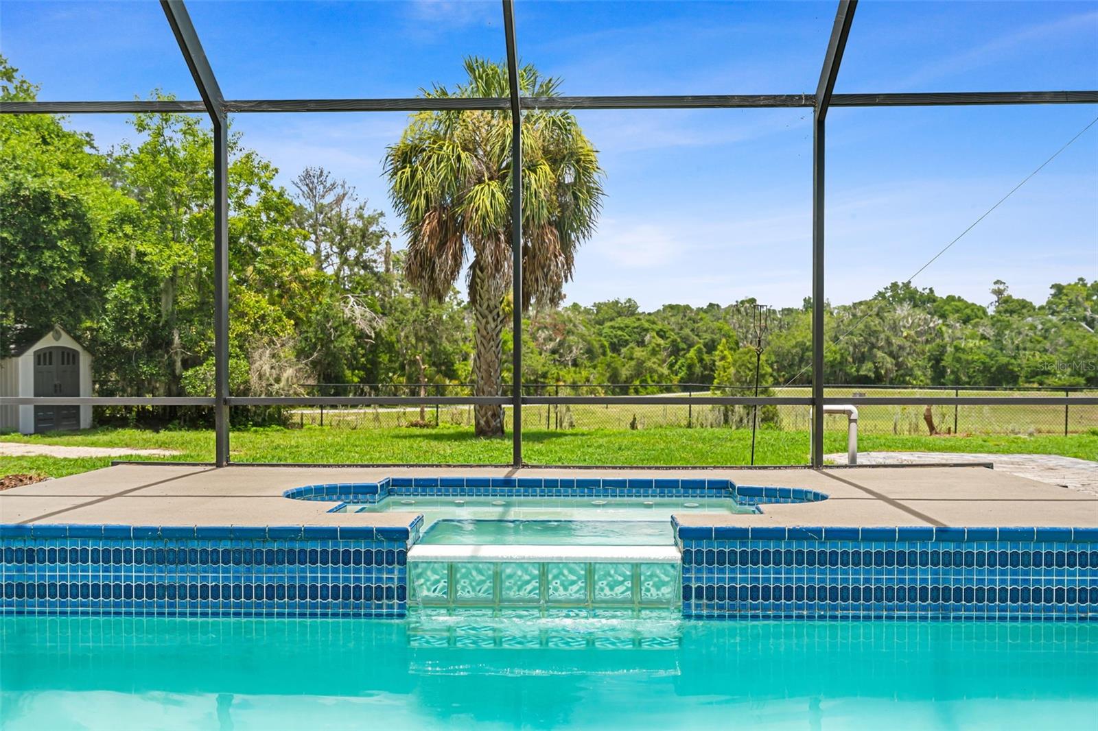Thoughtfully integrated into the pool design, the spa creates a stunning focal point for this exceptional outdoor retreat.