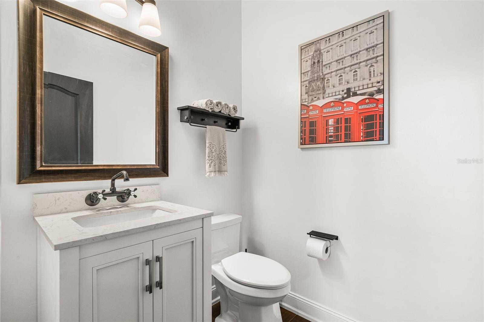 Conveniently located just off the main living areas and steps from the lanai, the elegant powder room is perfectly positioned for family and guests alike.