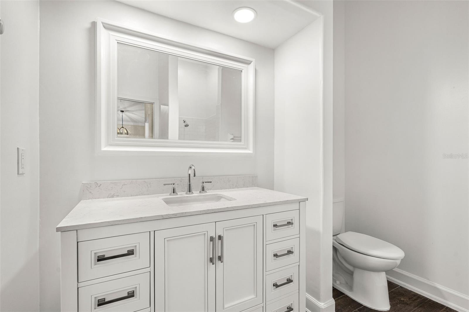 Beautifully appointed with timeless finishes, the full guest bath offers both elegance and everyday comfort for family and overnight guests.