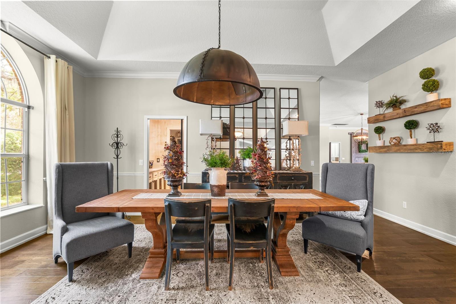 Beautifully connected to the walk-through pantry and chef's kitchen, the dining room blends timeless elegance with effortless everyday living.