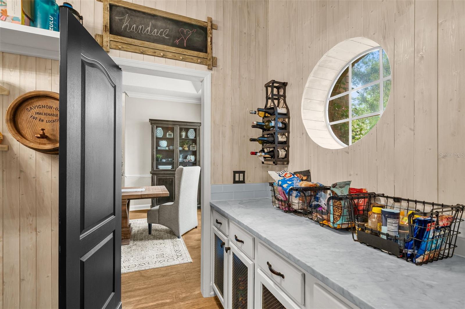 Designed with both beauty and function in mind, this spacious pantry keeps everything within reach while providing a convenient passage between gathering spaces.