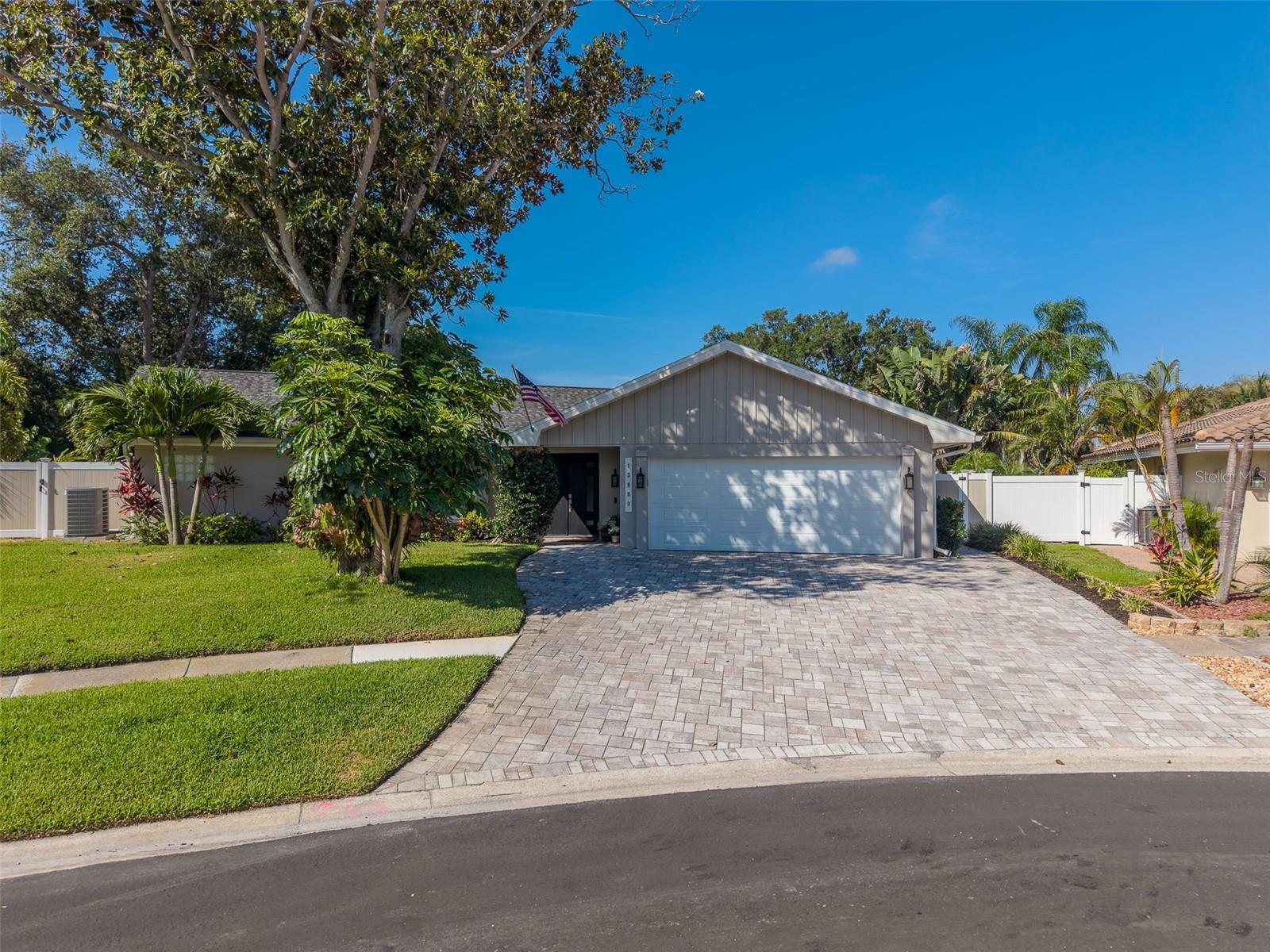Exterior of home with newly pavered driveway