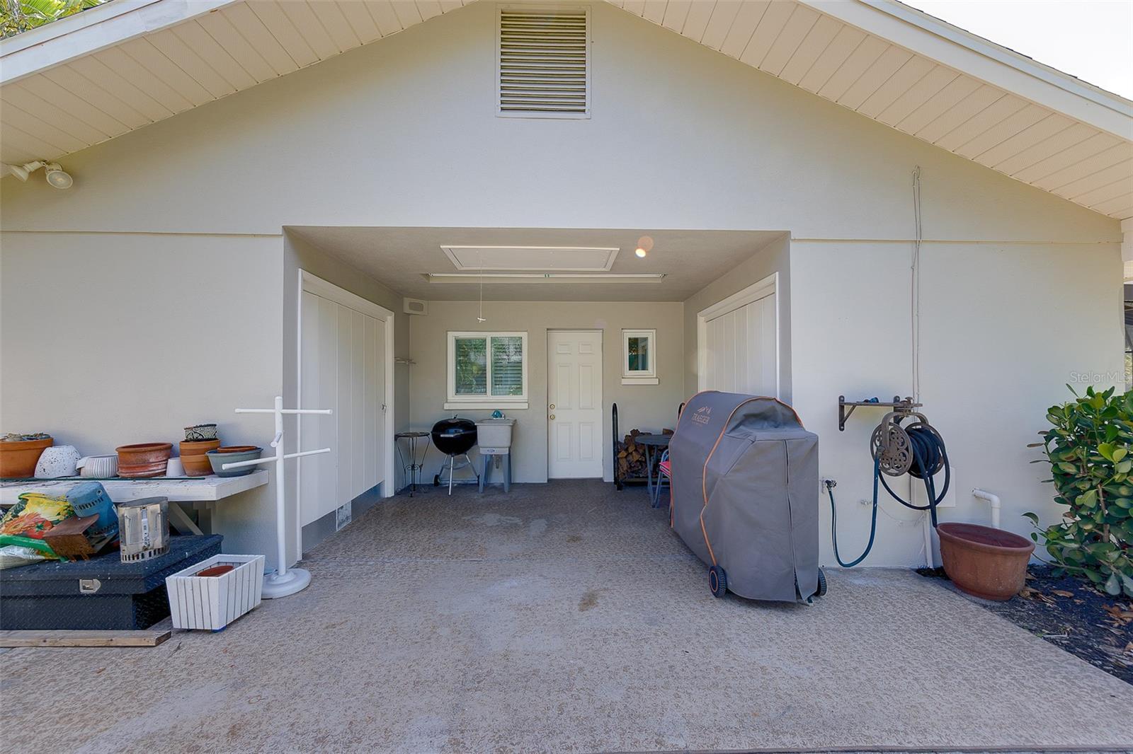 Entrance to the 2nd guest bedroom and private patio - can be used as in law suite. Extra storage for the yard with the 2 side closets