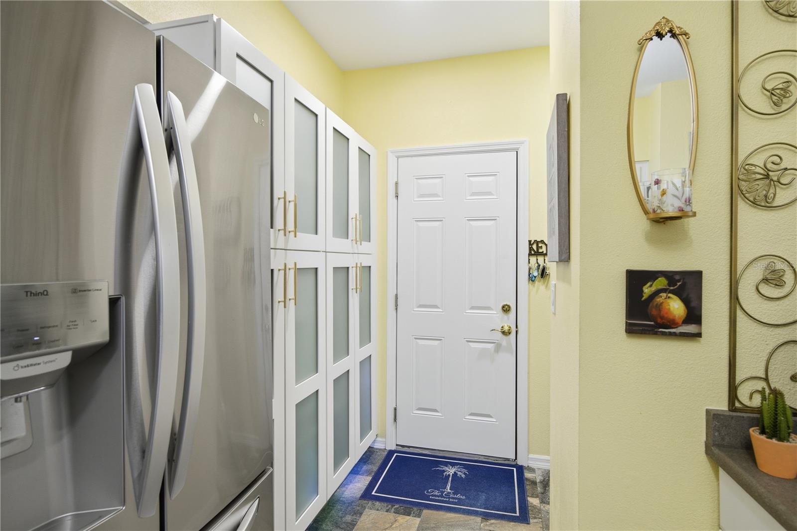 Double Pantry storage was added with frosted glass doors!