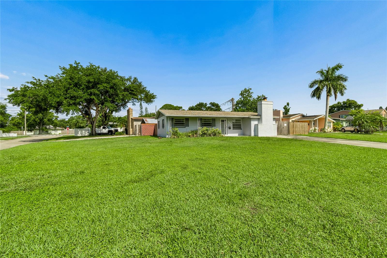 FRONT EXTERIOR WITH LARGE FORNT YARD