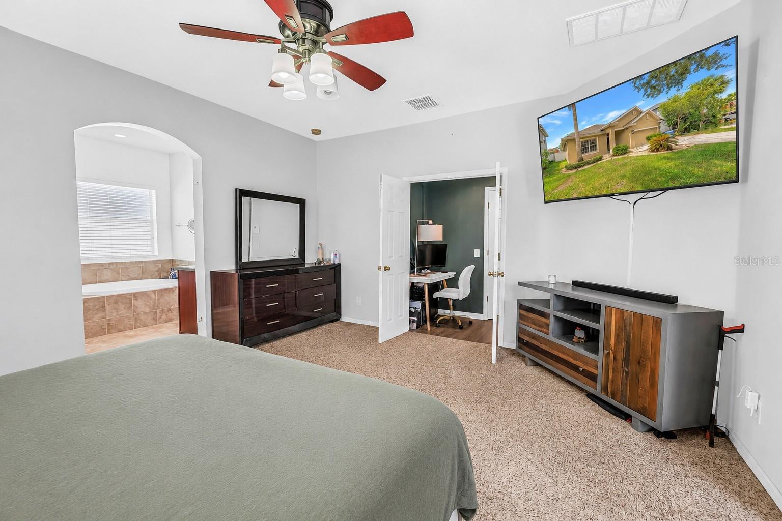 Primary Bedroom With View Into Primary Bath