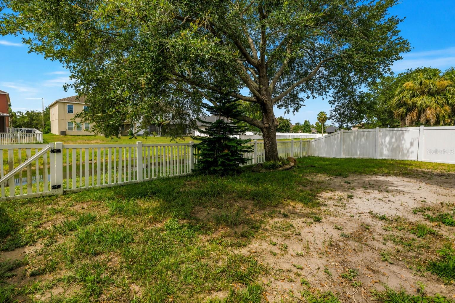 Backyard With Fence and Water View