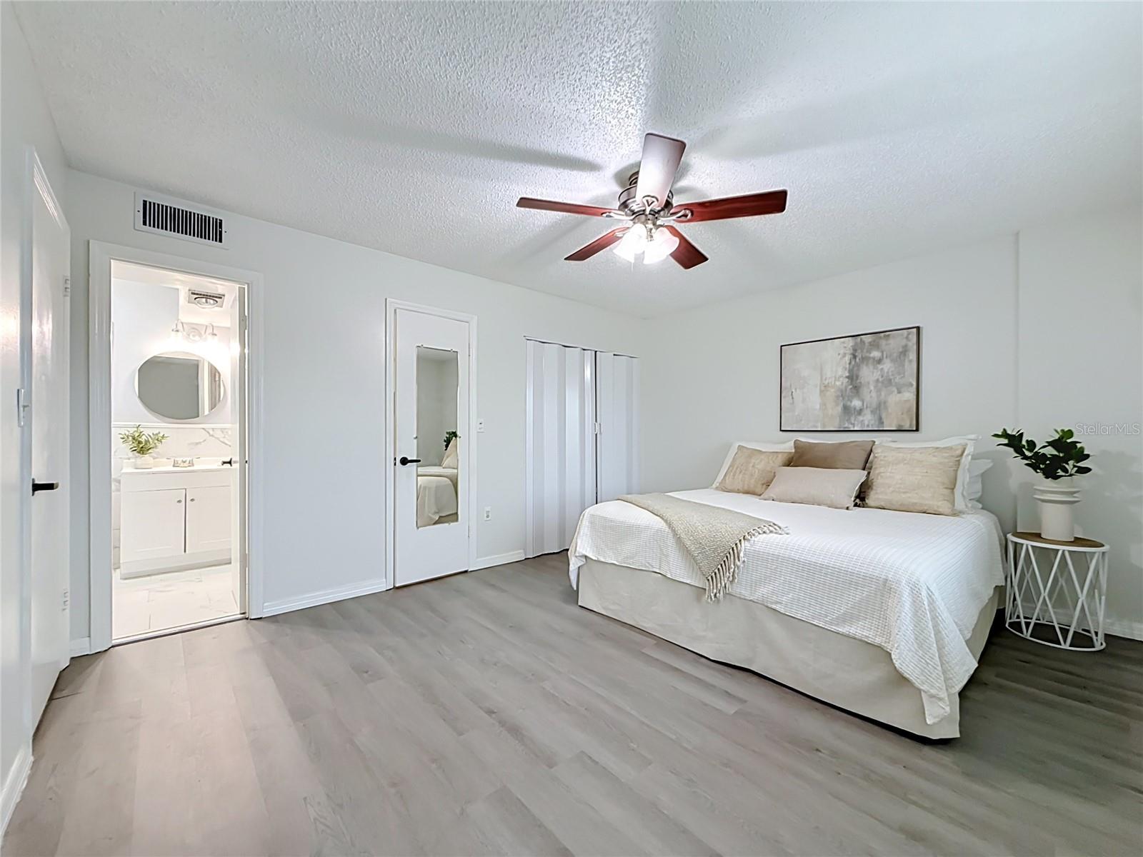 Primary Suite with Walk in and wall closet, private bath