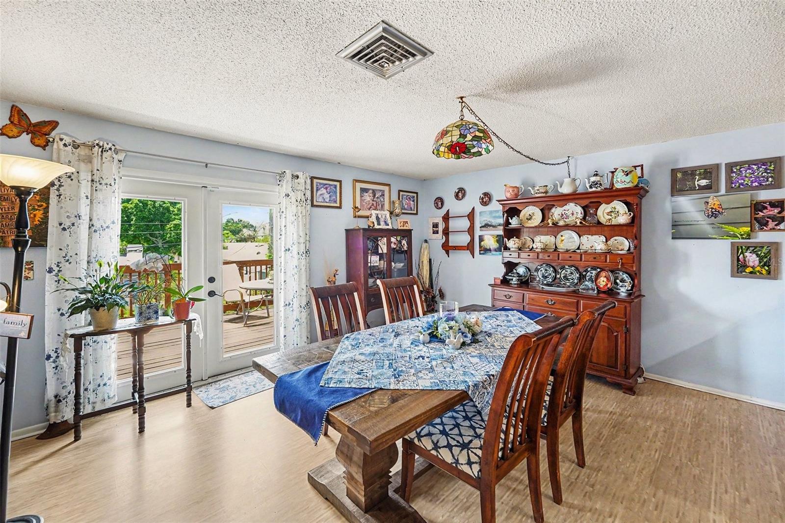 Open floor plan. The kitchen connects seamlessly to the dining and living areas. The french doors lead you to the  deck.