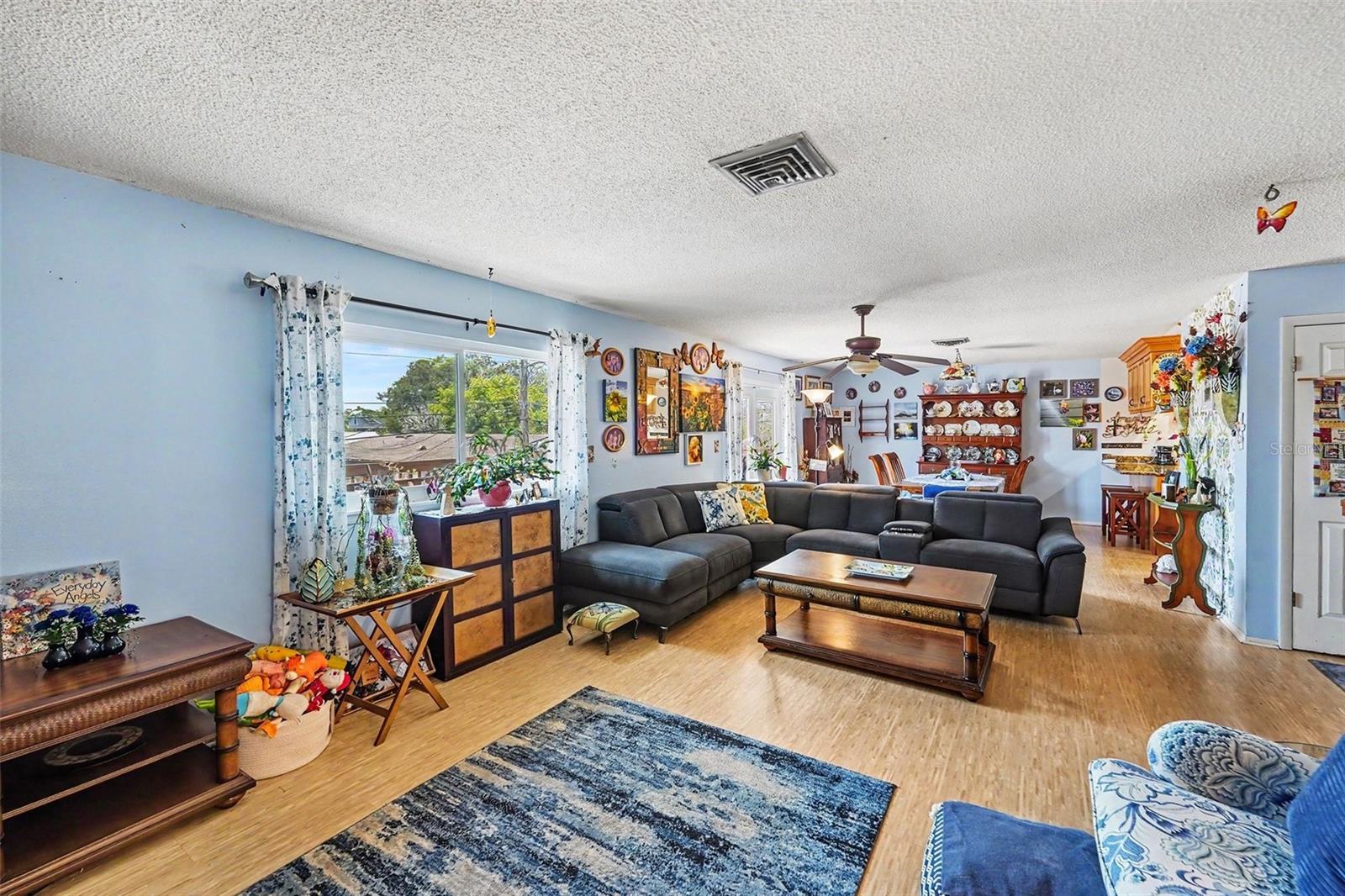 Open floor plan. The kitchen connects seamlessly to the dining and living areas.