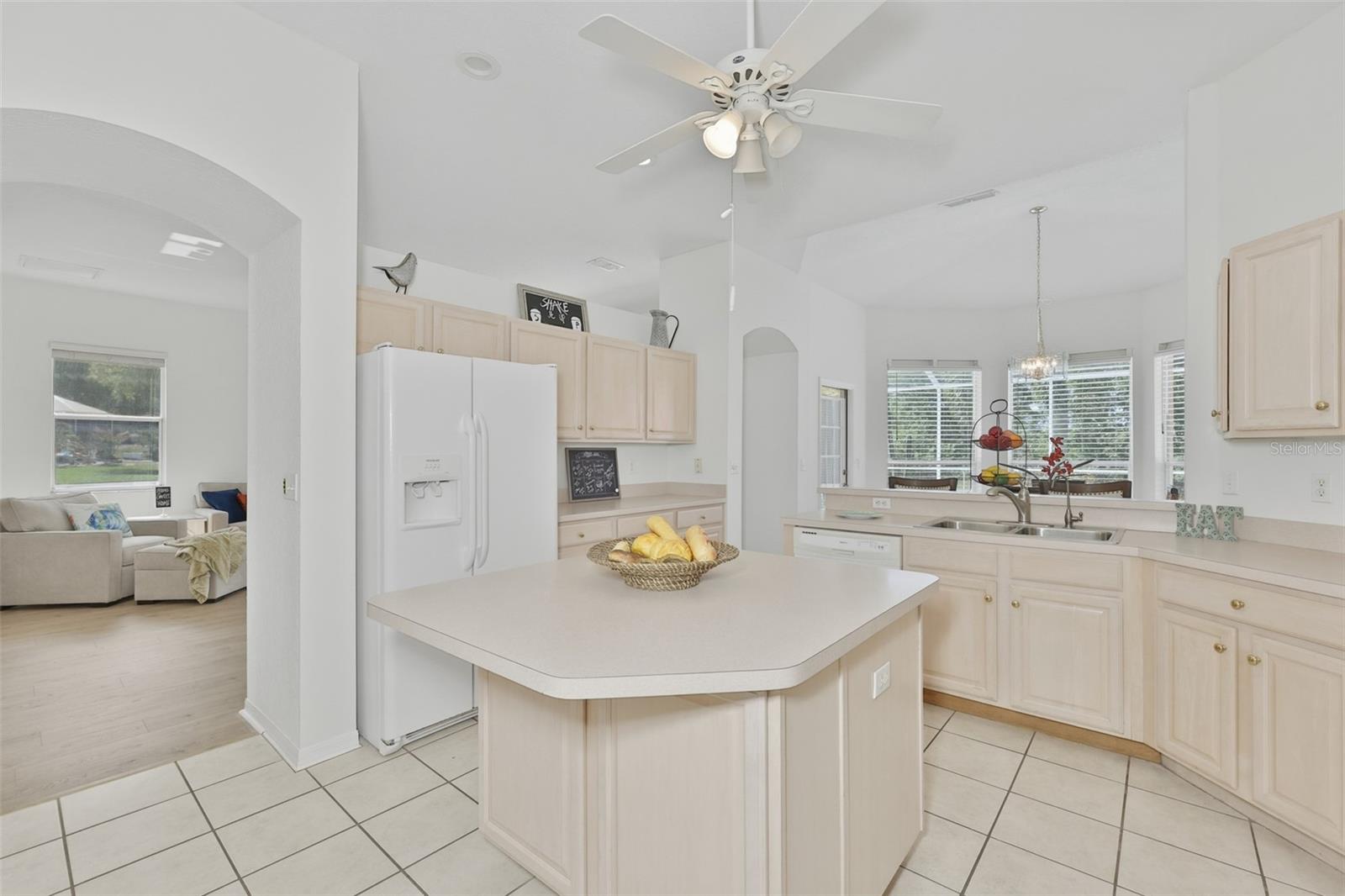 Refaced Cabinets, Tiled Floor, Large Center Island with Storage, Eat In Dinette With Great View of Pool & Rear Greenspace