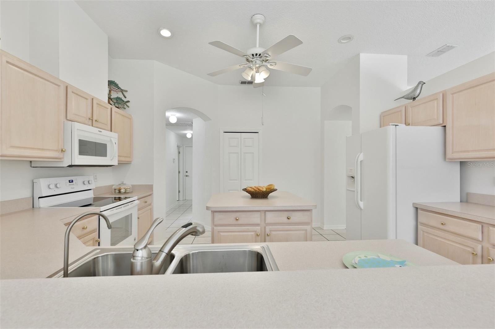 Refaced Cabinets, Tiled Floor, Large Center Island with Storage, Eat In Dinette With Great View of Pool & Rear Greenspace