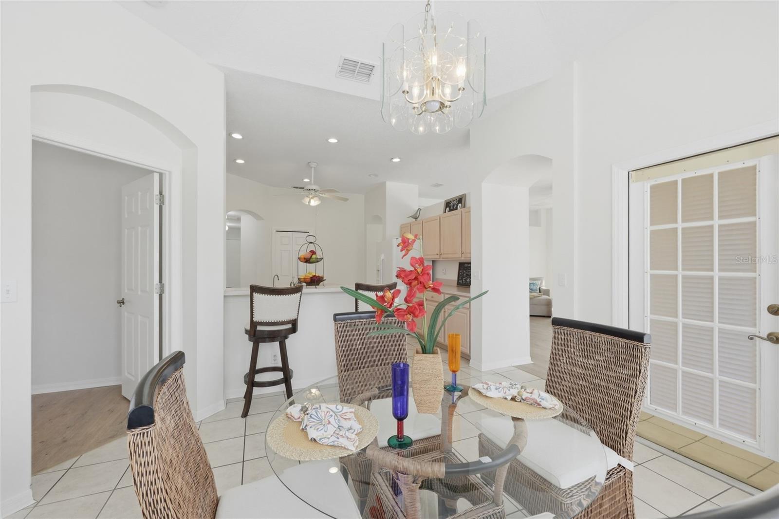 Dinette with Access to Rear Lanai & Large Bow Windows to View the Wonderful Outdoor Space