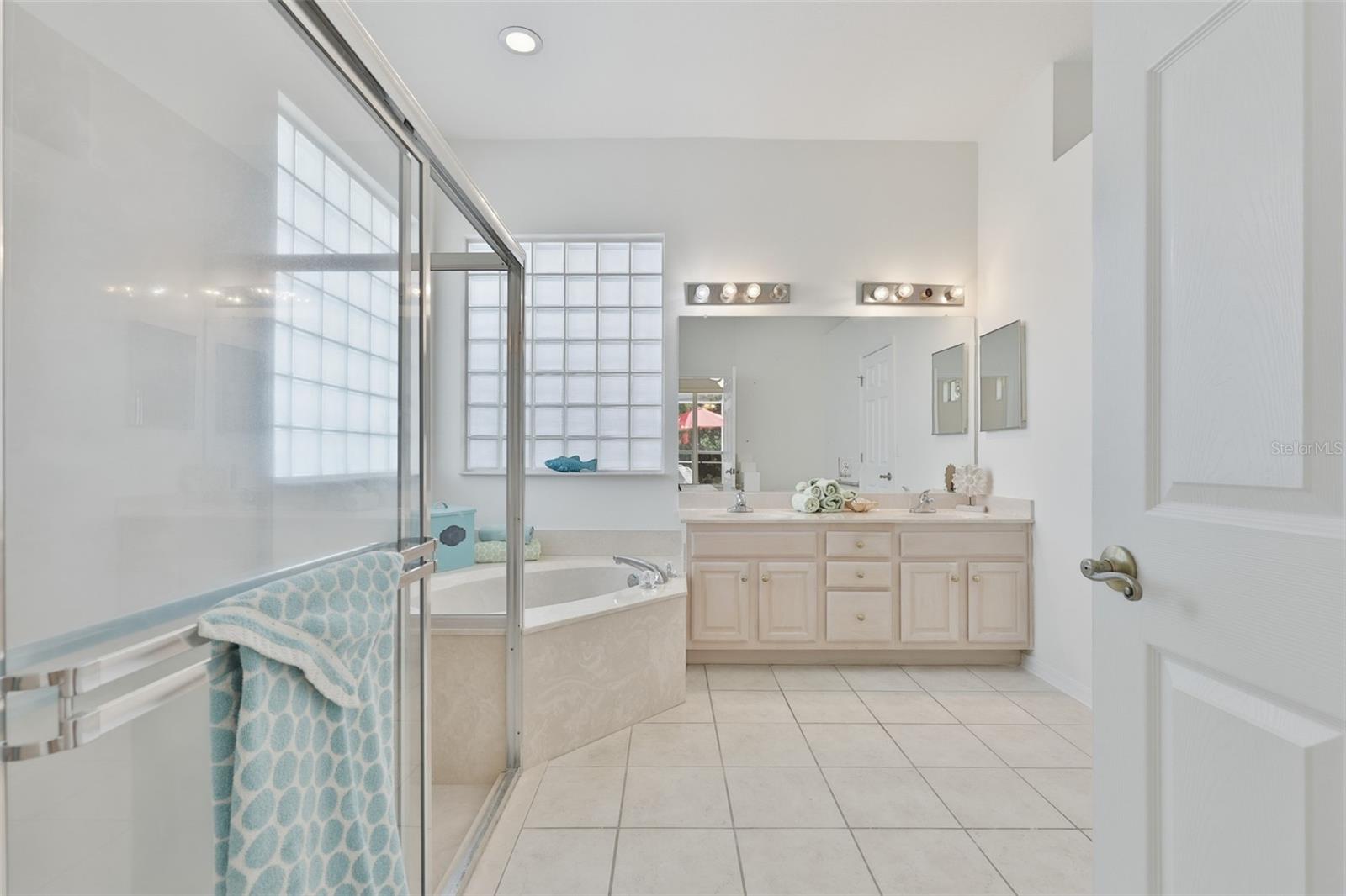 Primary Ensuite Bath, Walk-In Shower, Corner Spa Tub, Dual Vanities, Large Walk-In Closet