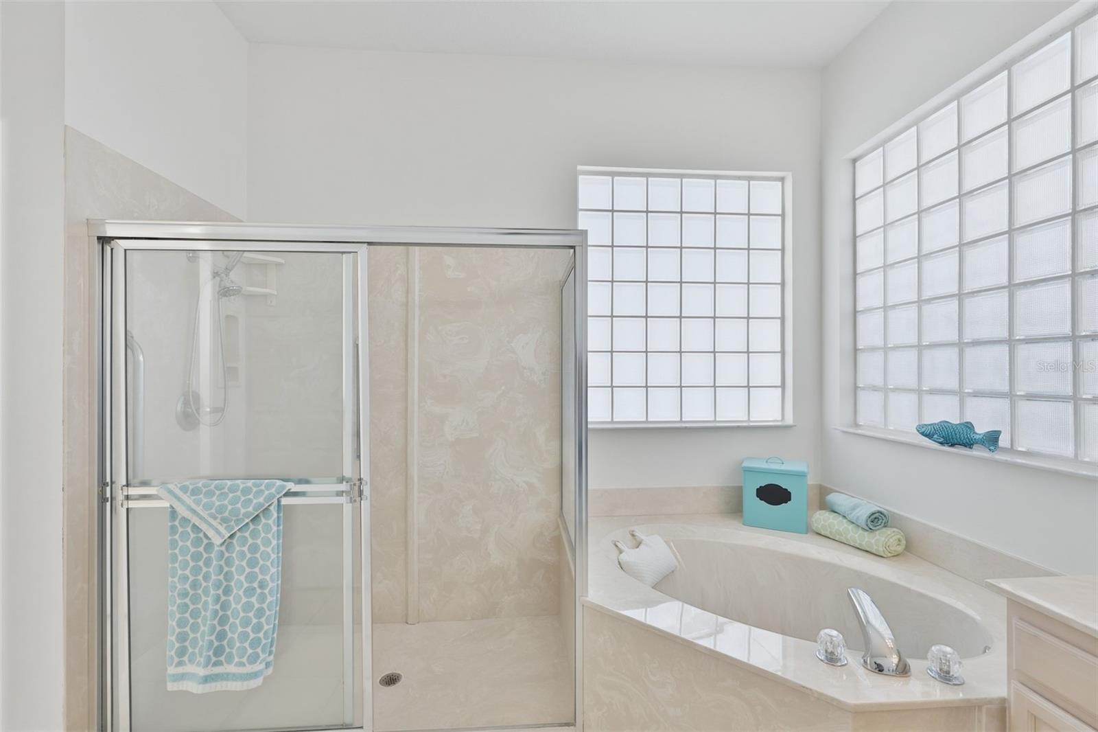 Primary Ensuite Bath, Walk-In Shower, Corner Spa Tub, Dual Vanities, Large Walk-In Closet