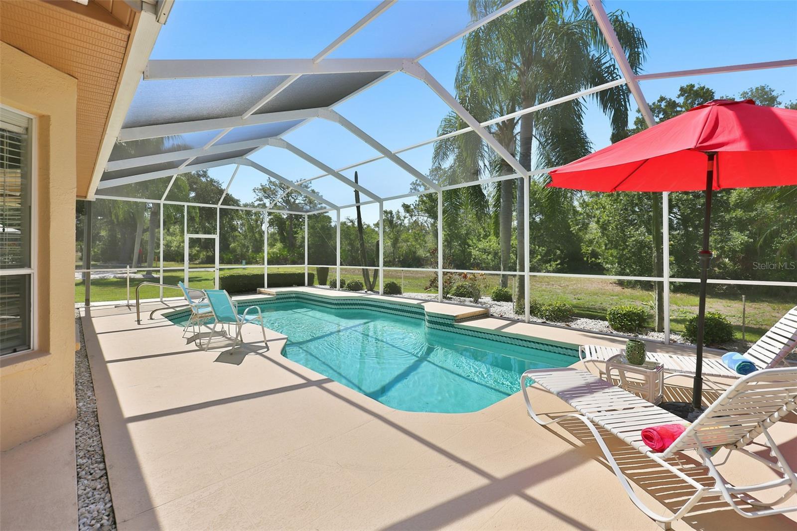Inviting Resurfaced Pool, Painted Coolcrete Pool Deck, Large Screened Lanai