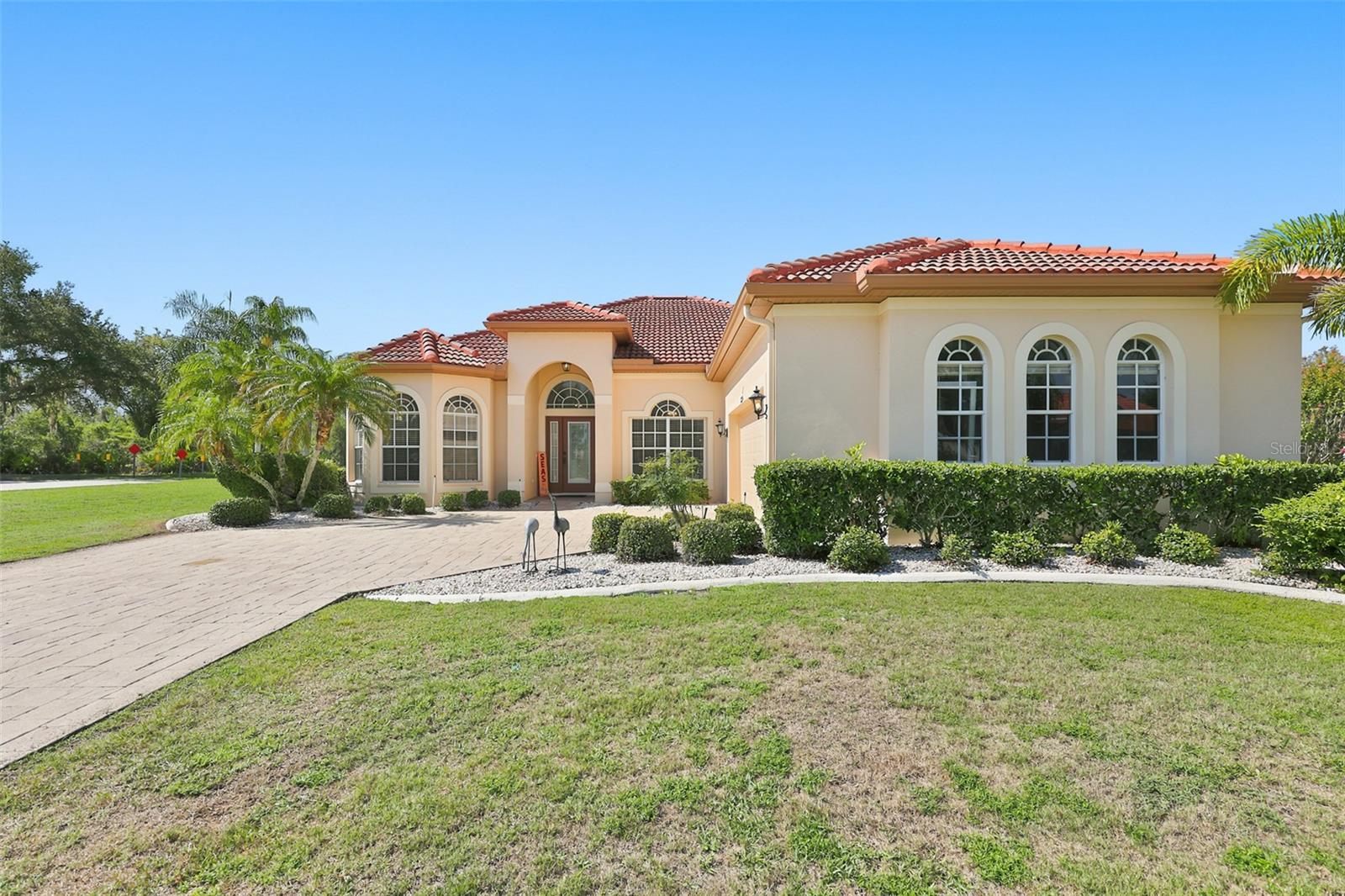 Exterior Front, Paved  Driveway, Side Facing Oversized Garage & Yard, Newer Tile Roof