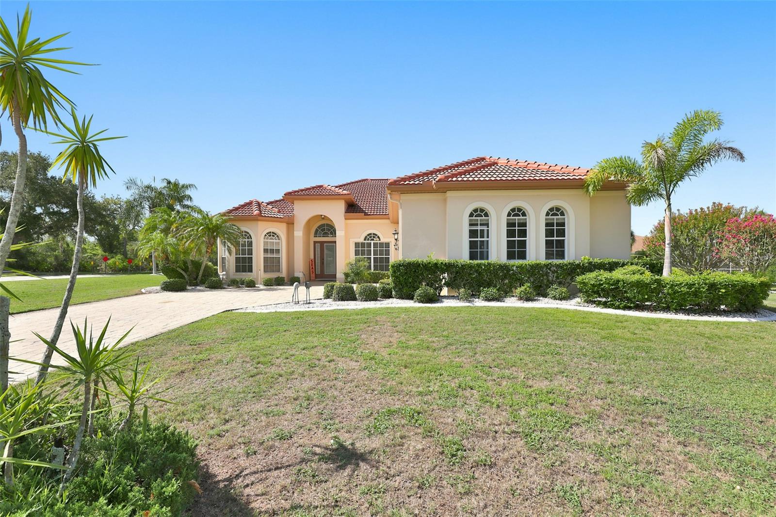 Exterior Front, Paved  Driveway, Side Facing Oversized Garage & Corner Lot