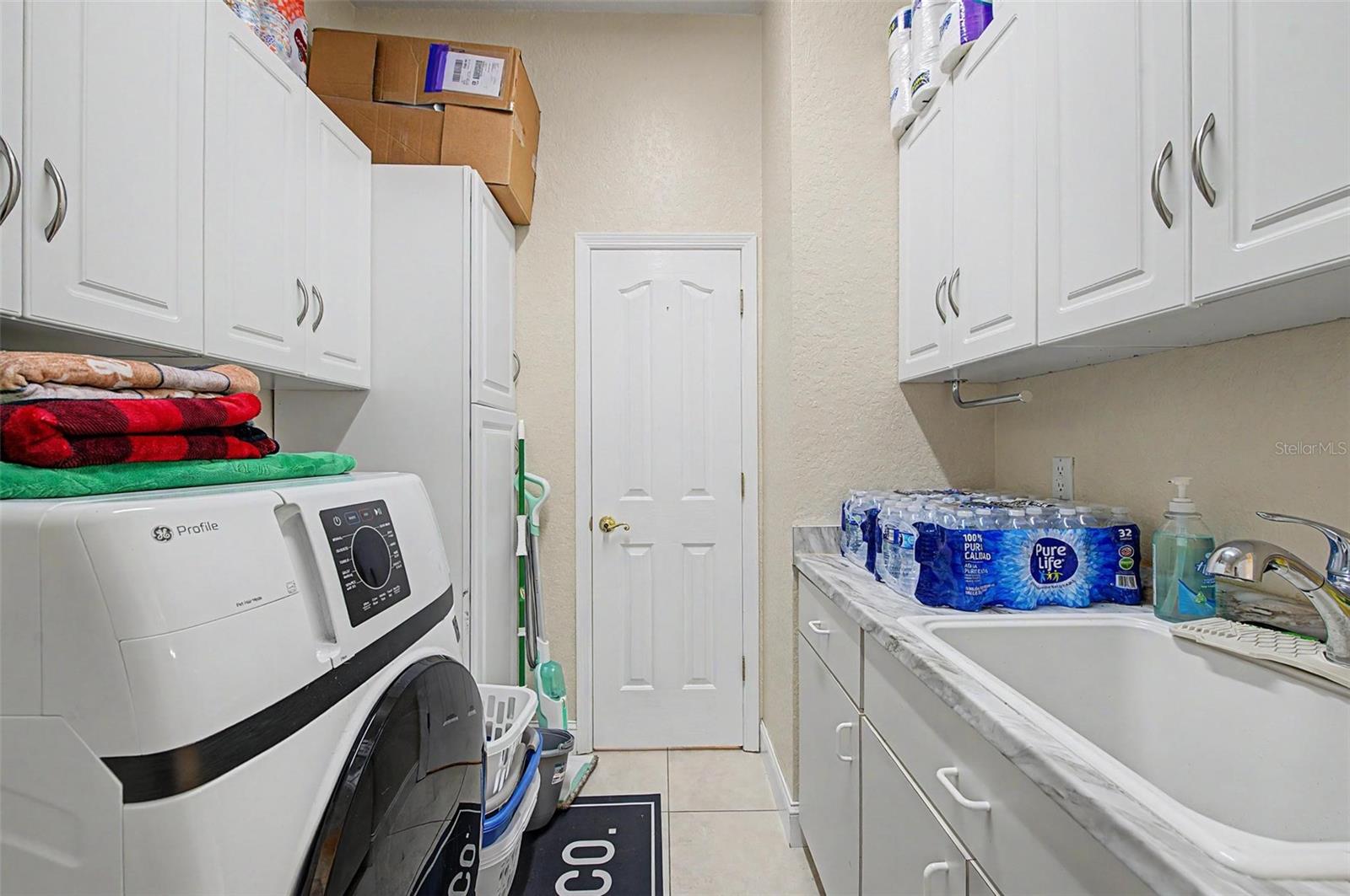 Laundry room near the two car garage.