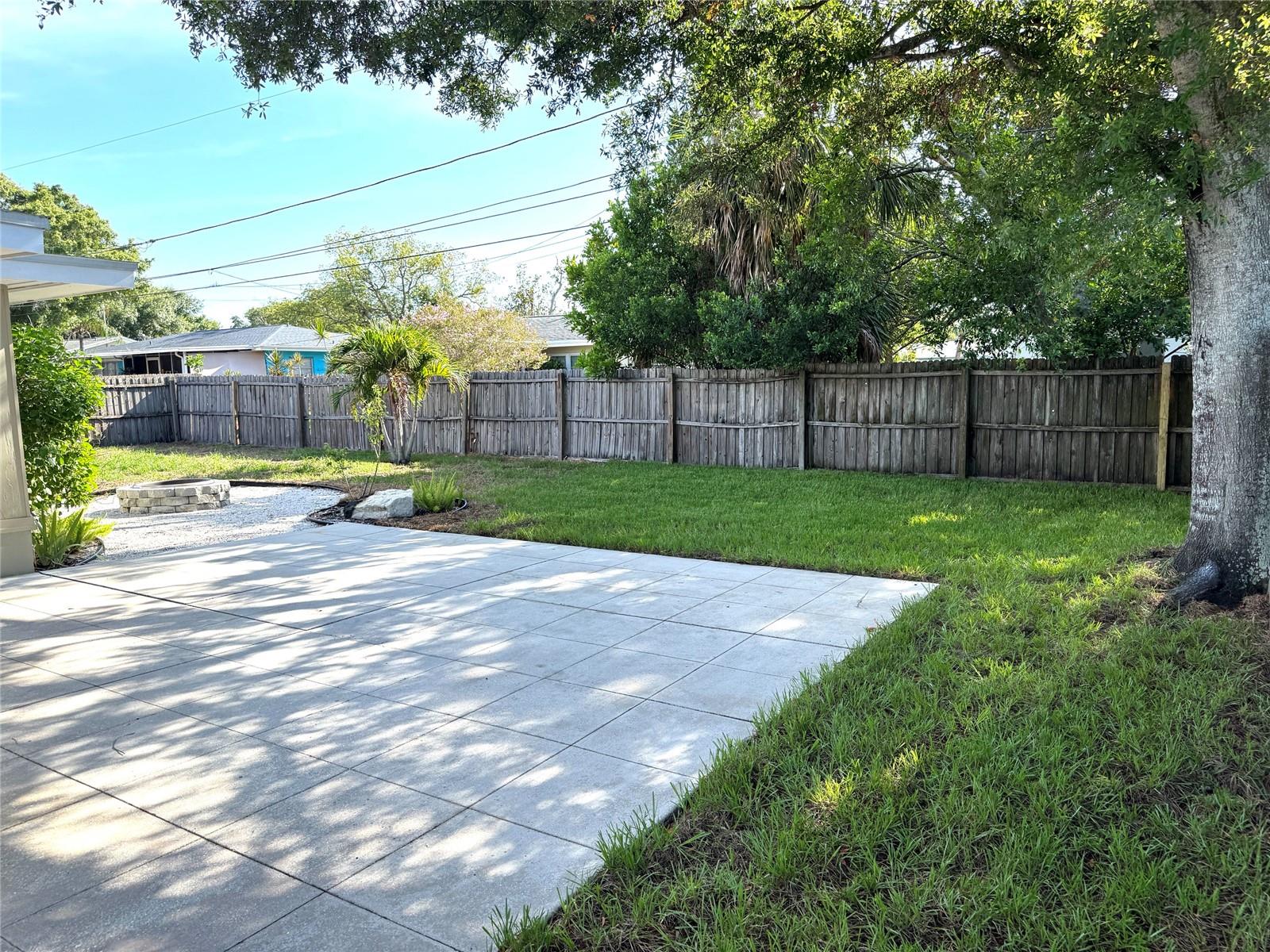 Large open outdoor patio with fire pit
