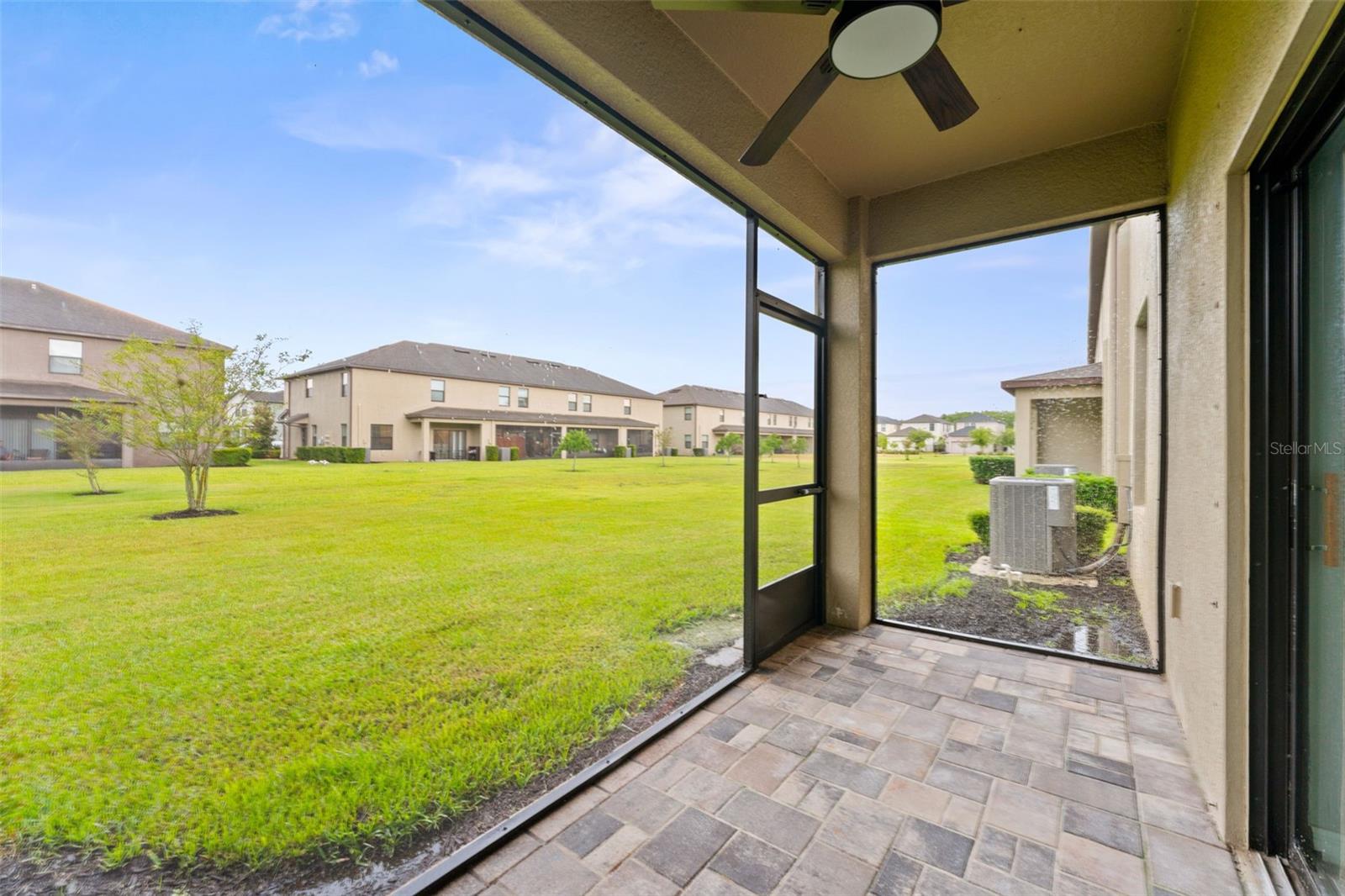 Step outside to your screened-in paver patio, the perfect spot for morning coffee or winding down at the end of the day
