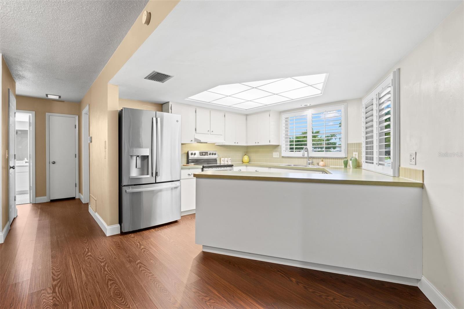 Kitchen with breakfast bar and golf course view