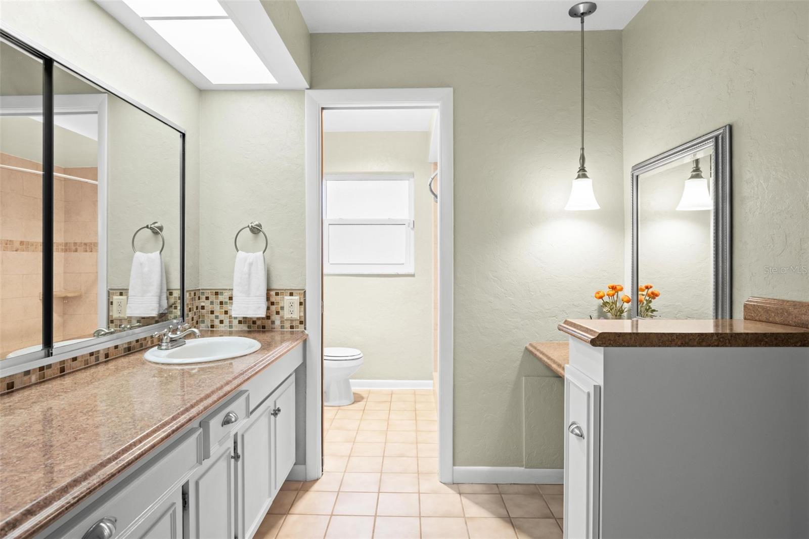 Primary bathroom and make up vanity