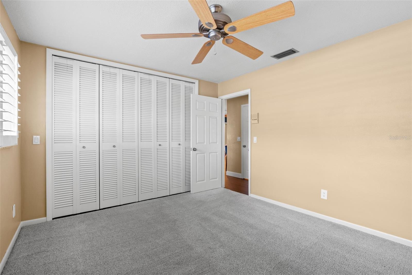 Bedroom 2 - ceiling fan and plantation shutters