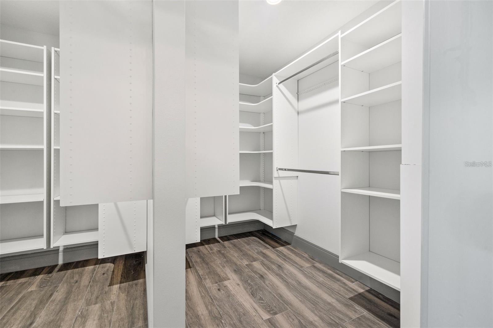 Primary bedroom walk in closet