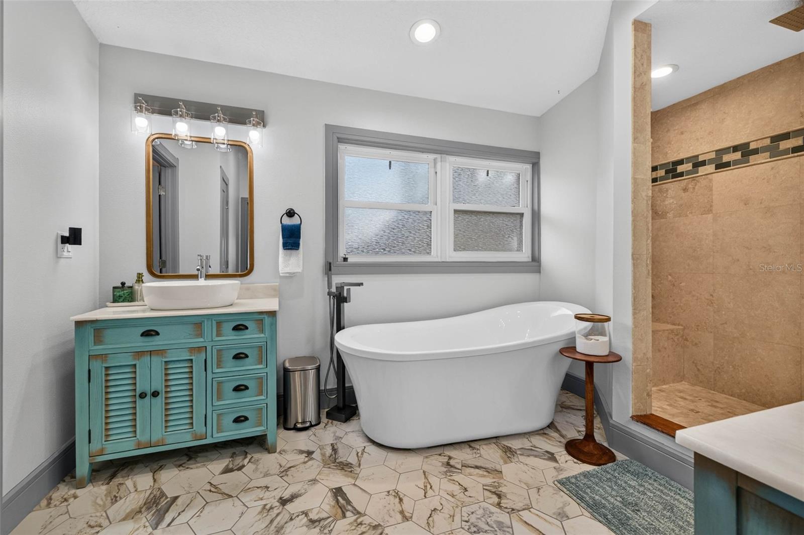 Primary bedroom en suite bathroom with soaking tub
