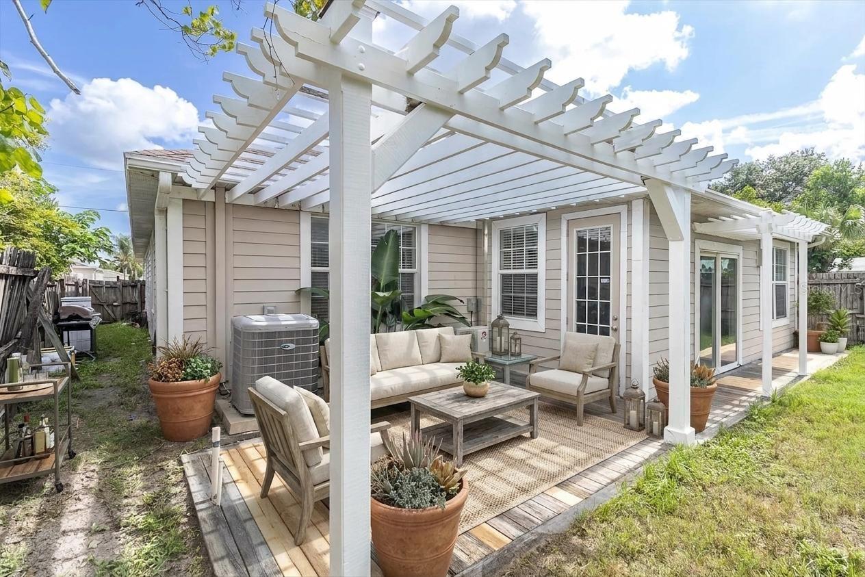 beautiful back yard patio with pergola