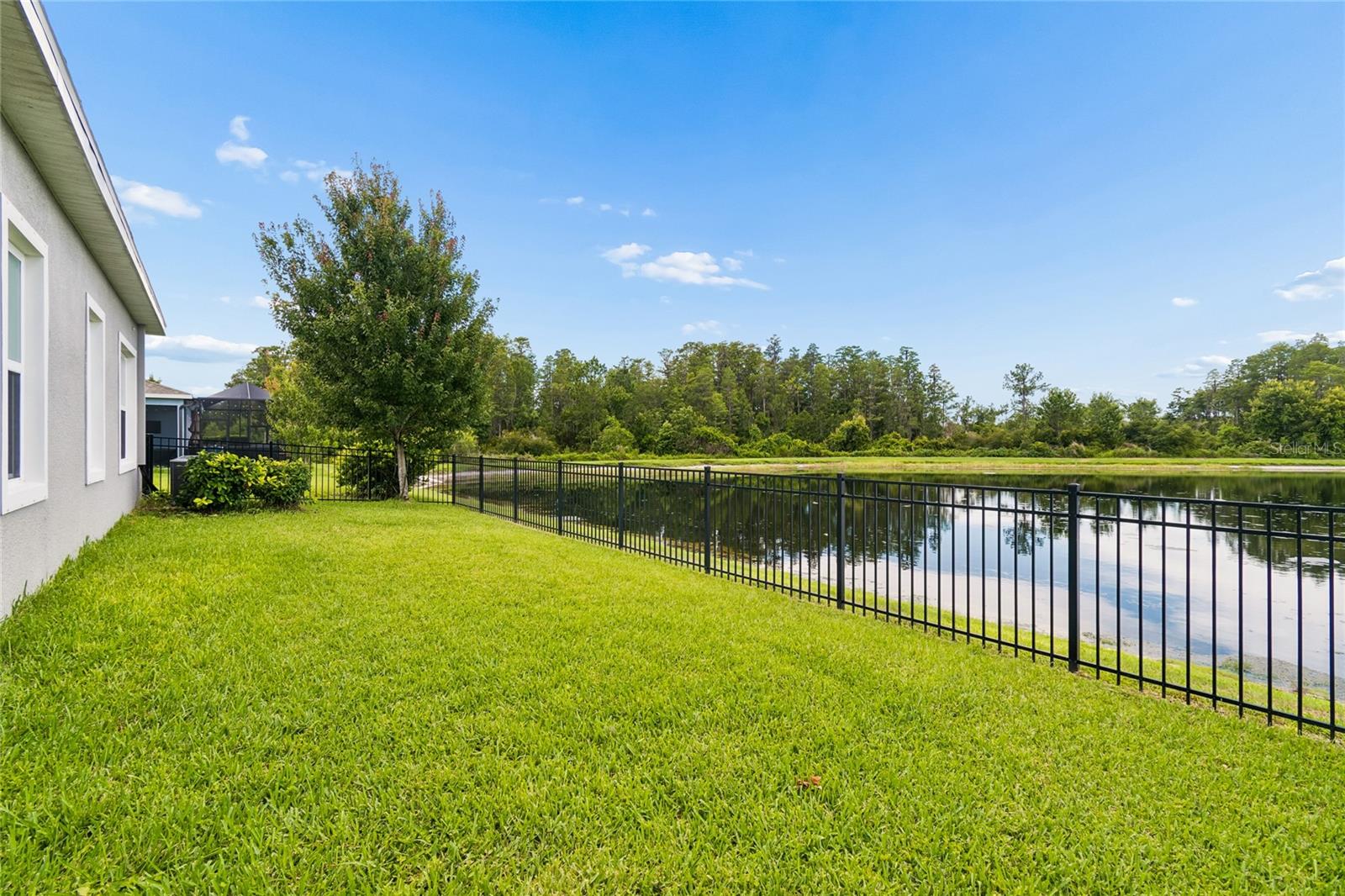 Side View of Home By The Lake