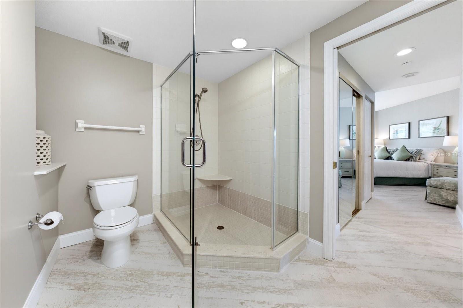 This generously spaced primary bathroom could be your next hideaway from it all. This exquisite shower welcomes you for a few moments of relaxation.