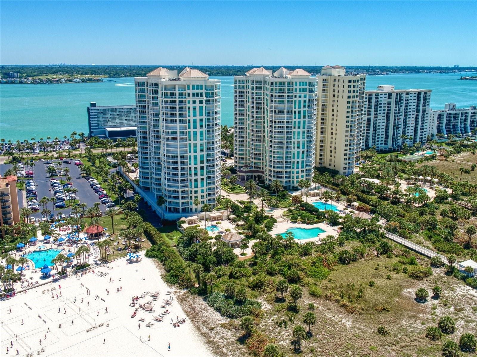 The grandeur of these towers beckon you to be a luxurious part of Sand Key beach life.
