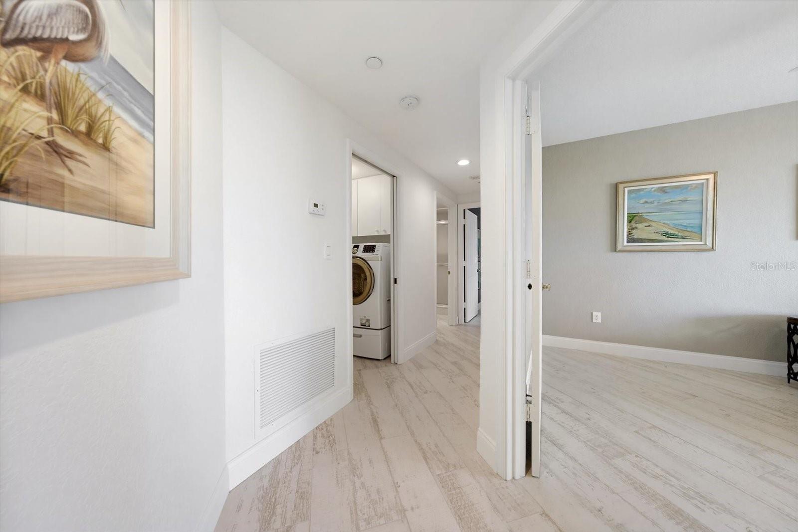 Hallway-The custom tiles flooring gives the appearance of beach wood for that coastal touch.